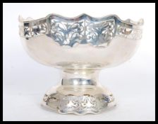 A large and impressive silver white metal table ce