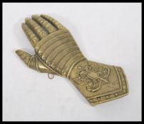 An antique style bronze / brass wall plaque in the