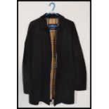 A gents designer Burberry 100% cotton short jacket / coat, the black jacket with the iconic Burberry