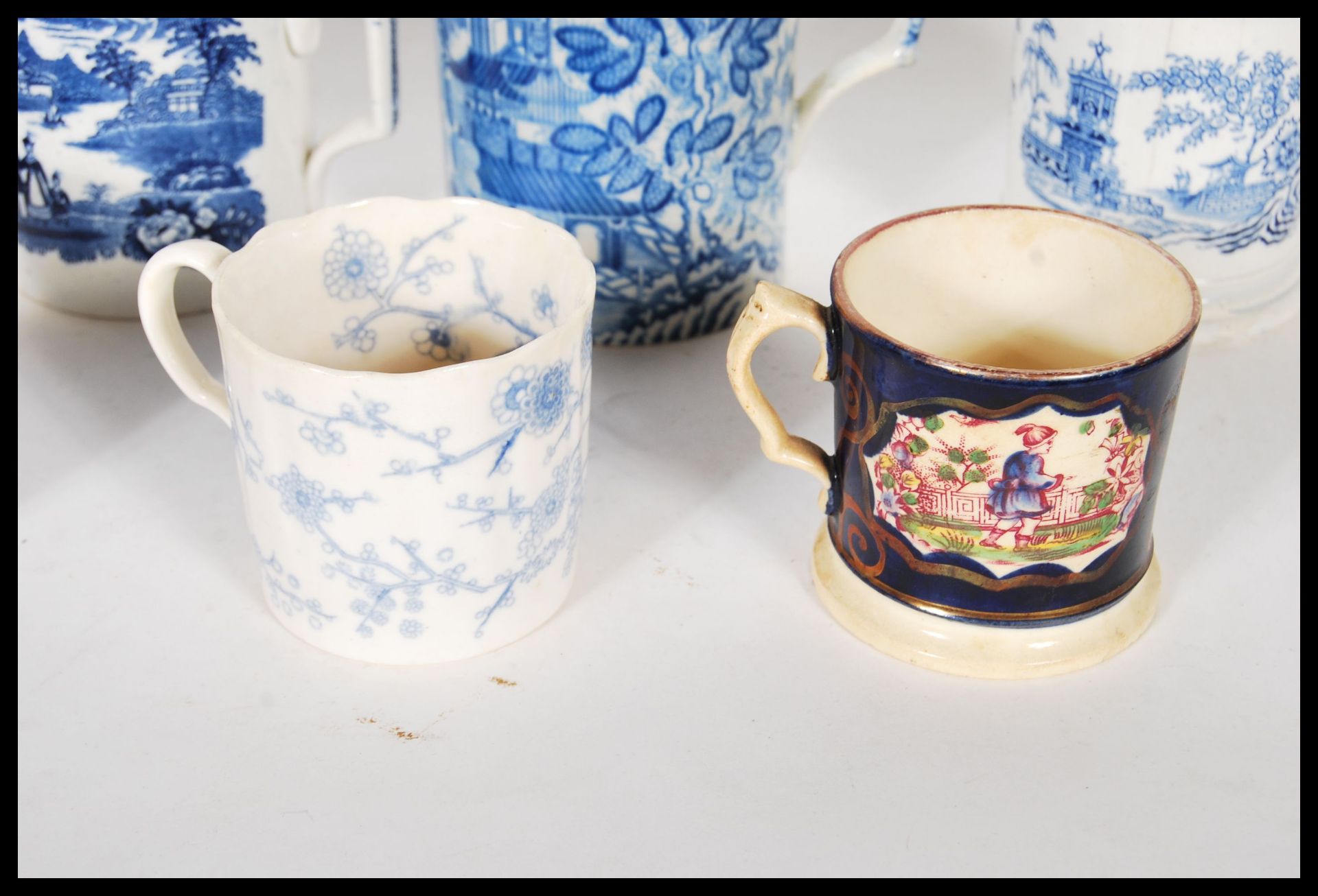 A collection of 19th Century Victorian Staffordshire mugs and cups, most having blue and white - Bild 4 aus 13