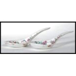 A pair of Chinese export famille rose spoons or ladles, 19th century, both painted with crickets