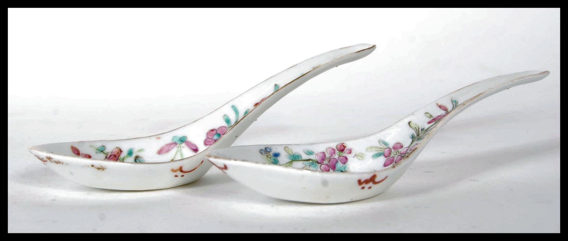 A pair of Chinese export famille rose spoons or ladles, 19th century, both painted with crickets