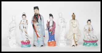 A group of 20th Century Chinese and Japanese ceramic figures to include a blanc de chine immortal
