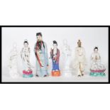 A group of 20th Century Chinese and Japanese ceramic figures to include a blanc de chine immortal