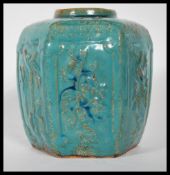 A Chinese stoneware ginger jar of hexagonal form having panels of raised floral decoration to the