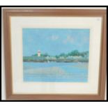 A 20th Century print on paper of a port with moored sailing boats,a lighthouse and  buildings,