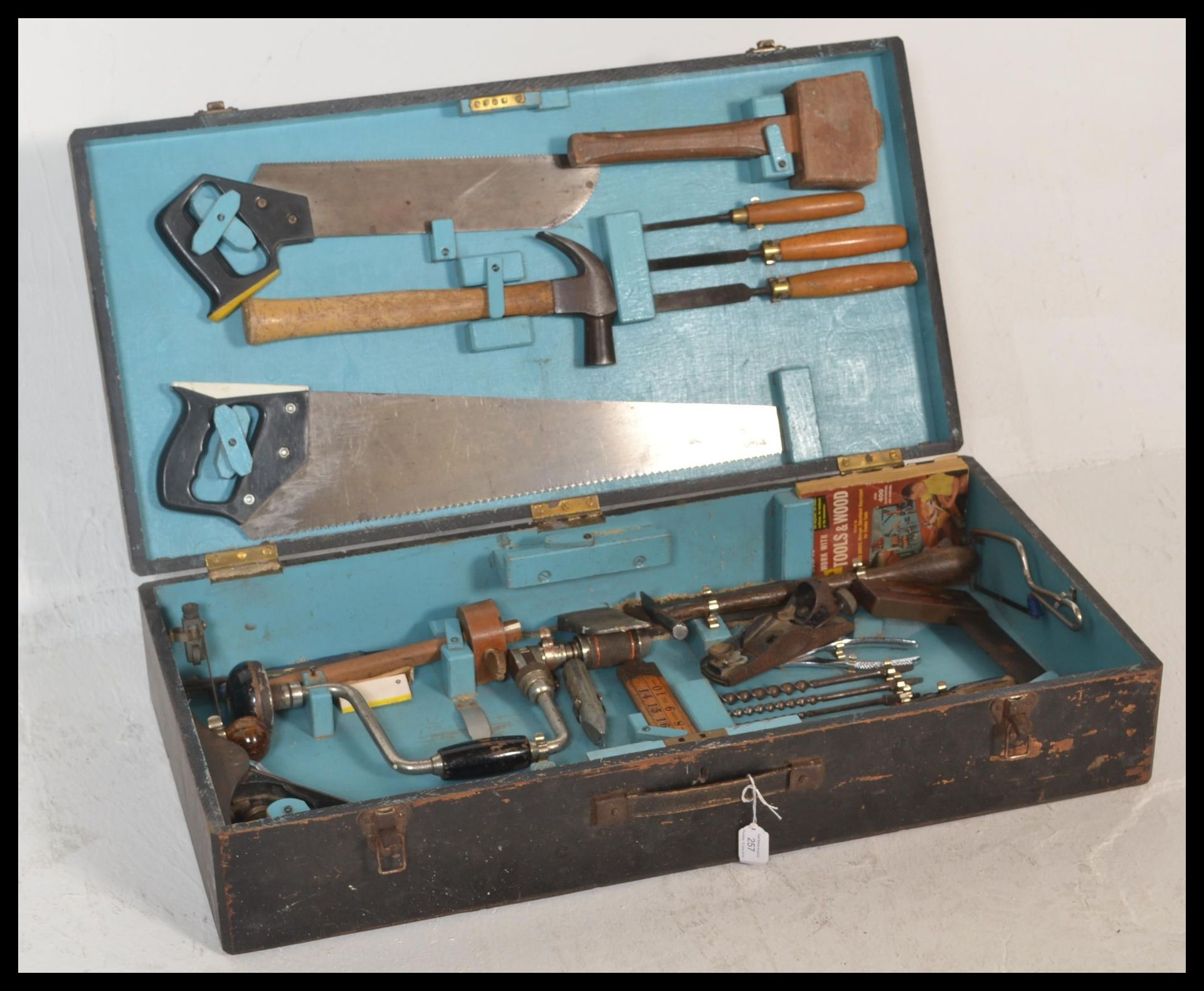 A vintage mid 20th Century 1950's ebonised wood working work box, the hinged lid opening to reveal a