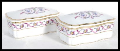 A matching pair of 20th Century ceramic trinket boxes by Richard Ginori- Pittoria, having scroll and