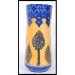 A early 20th Century Royal Doulton luster vase, having blue geometric patterns to top and bottom, on