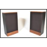 A pair of 20th Century Advent Legacy II floor standing audio speakers the speakers within elm