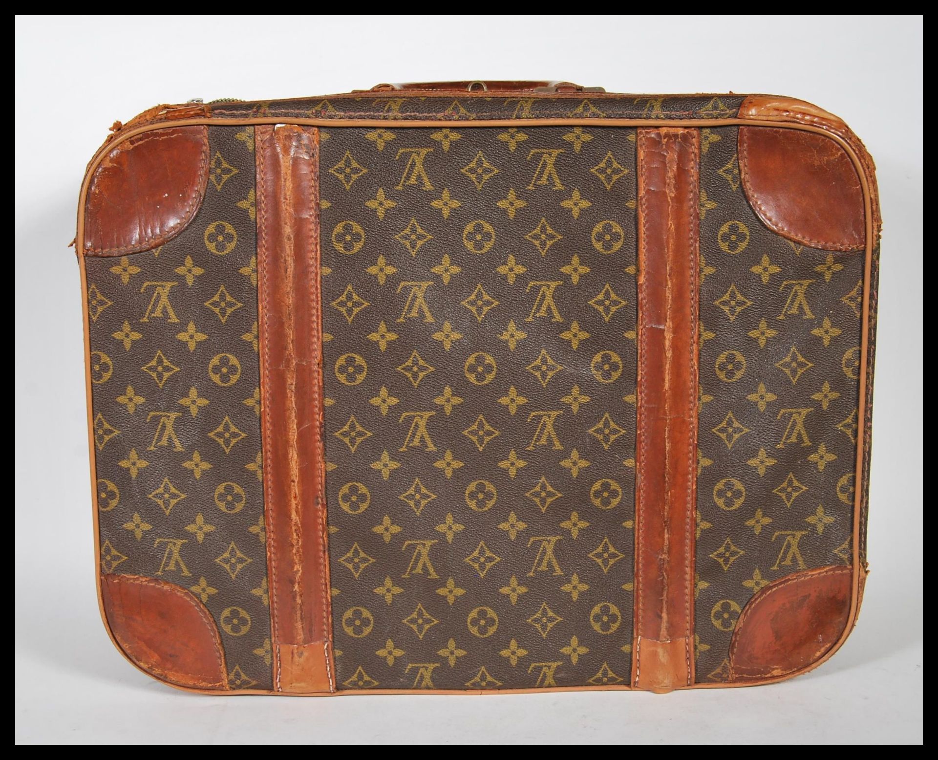 A Louis Vuitton hard suitcase in monogram canvas, second half 20th century, covered in LV monogram