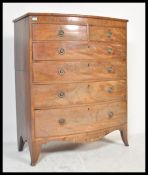 An early 19th Century Georgian mahogany bow front attic chest of drawers having inlay decorated top.