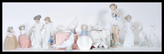 A collection of thirteen Nao by Lladro porcelain figurines to include five geese, one being