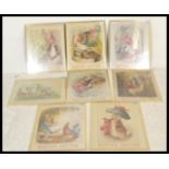 A collection of eight framed and glazed Beatrix Potter prints featuring Peter Rabbit and friends