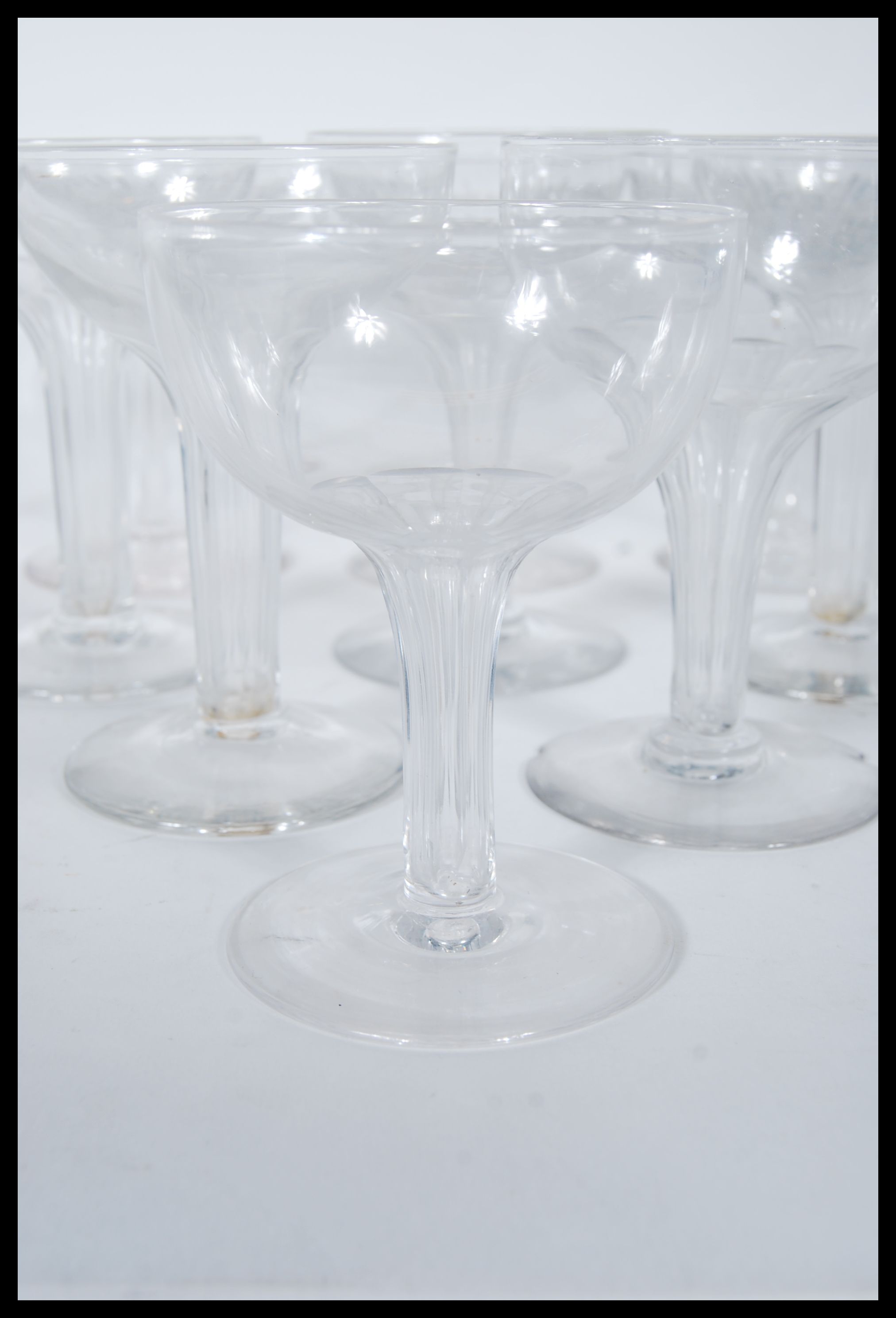 A collection of 19th century / early 20th century champagne glasses, the bowls set on tall stems - Image 3 of 5