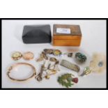 A collection of vintage jewellery to include a hallmarked 9ct gold bangle bracelet having engraved
