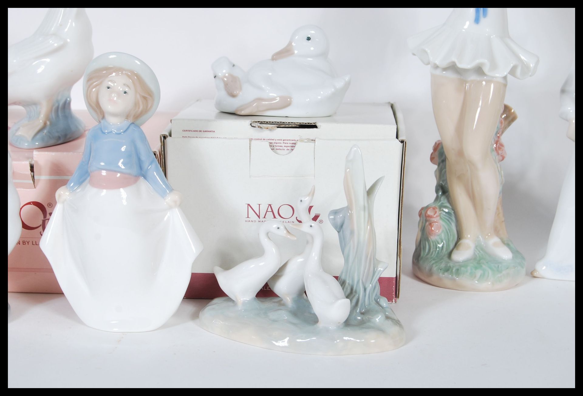 A collection of thirteen Nao by Lladro porcelain figurines to include five geese, one being - Bild 4 aus 6