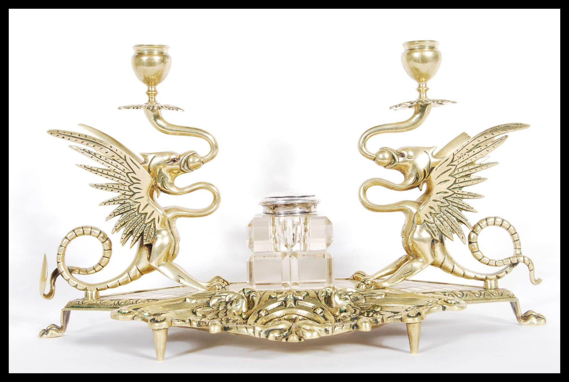 A 19th Century cast brass desk tidy / inkstand, with dual griffin sconces to both sides having glass