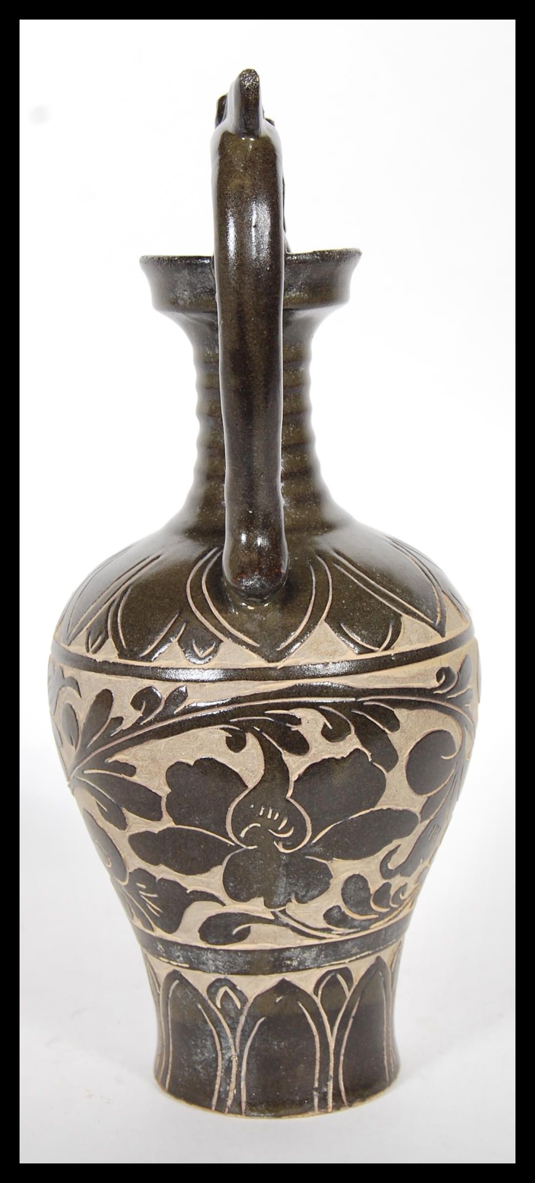 A Chinese stoneware vase / urn having shaped twin handles with floral relief decoration to the - Image 4 of 6