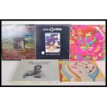 A collection of vinyl long play Lp record albums pertaining to Eric Clapton to include