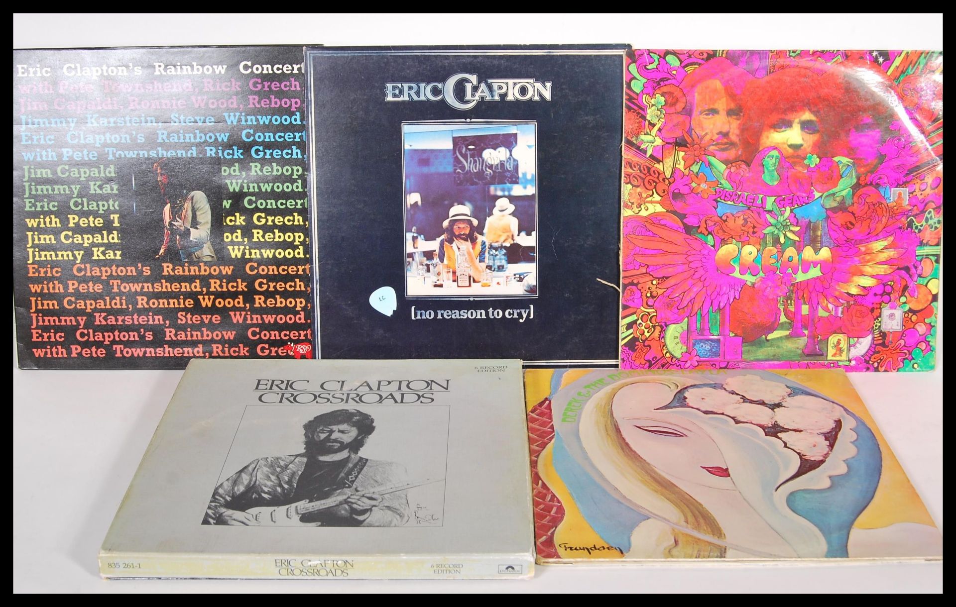 A collection of vinyl long play Lp record albums pertaining to Eric Clapton to include