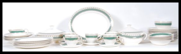 An extensive Crown Ducal dinner service in the 'Chatsworth' pattern containing dinner plates, side