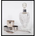 A collection of silver hallmarked items to include a silver collared perfume bottle, a silver
