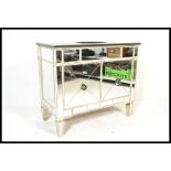 A contemporary Venetian glass mirrored free standing cabinet / sideboard vanity unit having a