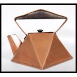 A early 20th Century Art Deco copper kettle in the style of Christopher Dresser, being hexagonal