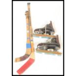 A group of ice ickey related items to include two wooden hockey sticks comprising: Checking and