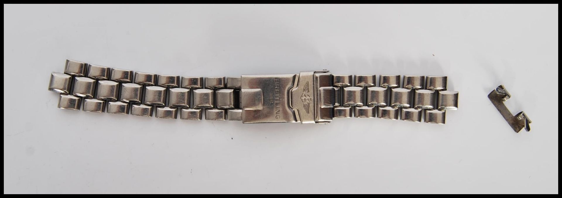 A 20th Century gents stainless steel watch strap for Breitling, stamped Breitling 1884. Measures