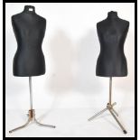 A pair of 20th Century shop display mannequins, the mannequin torsos upholstered in a black satin