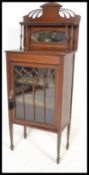 An early 20th Century Edwardian inlaid mahogany china display cabinet of small proportions, mirror
