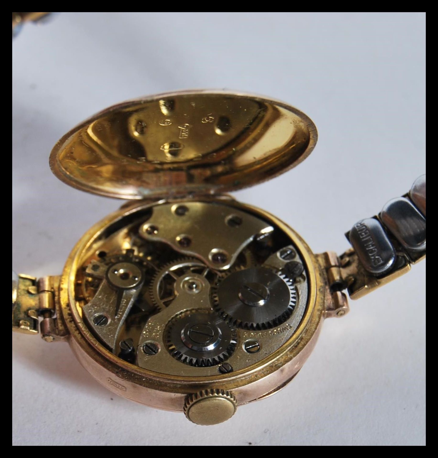 A 9ct gold ladies cocktail watch, enamel face with Arabic numerals, set to a gilt metal expanding - Image 4 of 10