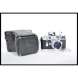 A Leica M3 Rangefinder chrome camera by Ernst Leitz GmbH Wetzlar Germany, serial number 928487.