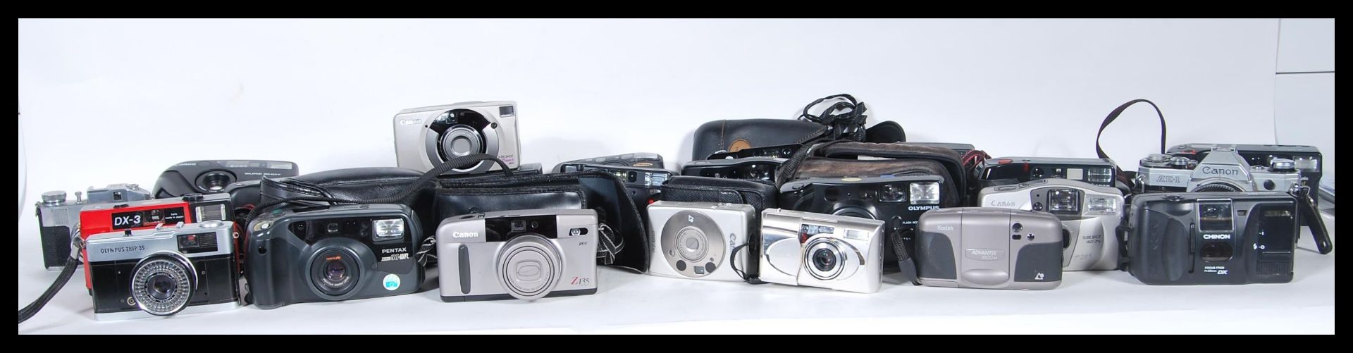 A collection of vintage 20th Century 35mm camera lenses and accessories from various makers and