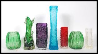 A collection of seven vintage 20th Century studio art glass in the manner of Geoffrey Baxter for