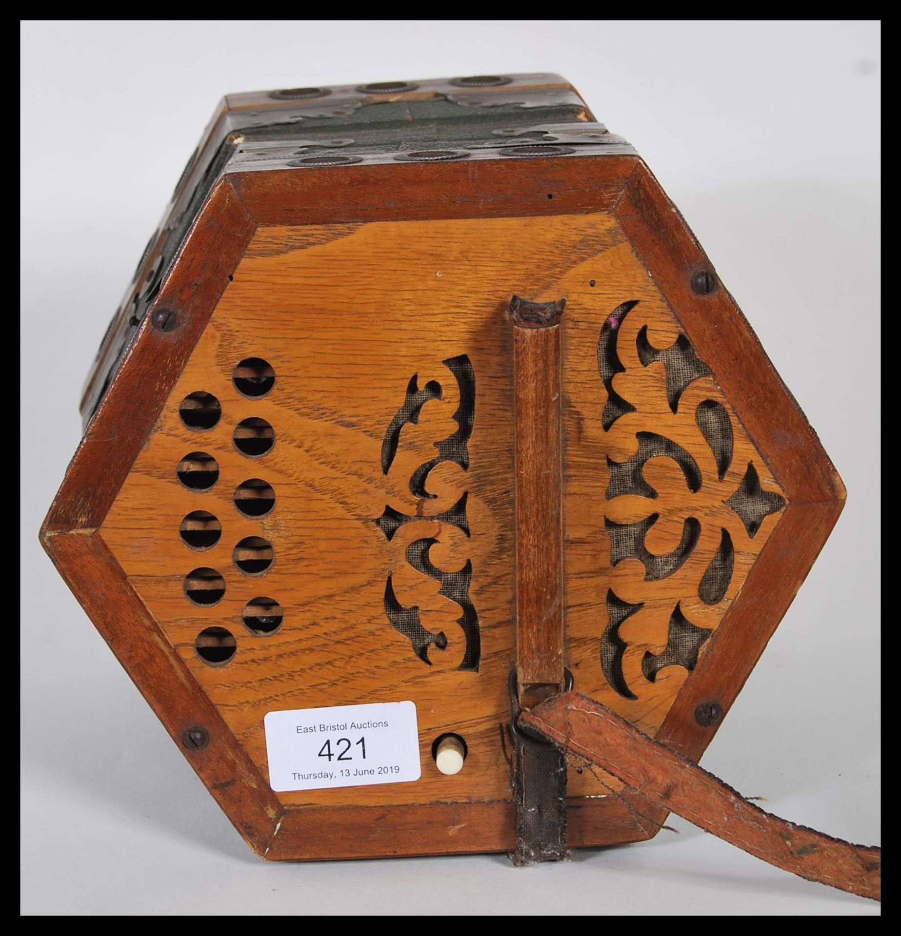 A vintage early 20th Century squeeze box of hexagonal form having pierced wood handles at each end - Bild 2 aus 4