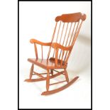 A Victorian antique style rocking chair / windsor armchair. Sleigh runners with turned legs united