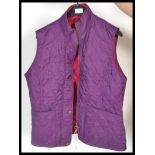 A ladies quilted Gilet by barbour, UK size 16, pockets to outside and in with original Barbour label