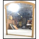 A good early 19th century very large gilt wood overmantel mirror. The large frame with gilded finish