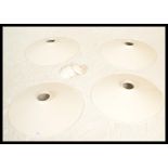 Light Shades - A group of four retro industrial factory style UFO form lampshades having white