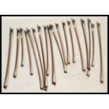 A collection of 20th Century violin bows, most bows being brazilwood and Pernambuco with ebony,