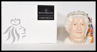 A Royal Doulton character jug depicting Her Majesty Queen Elizabeth II D7256 , handle modelled as