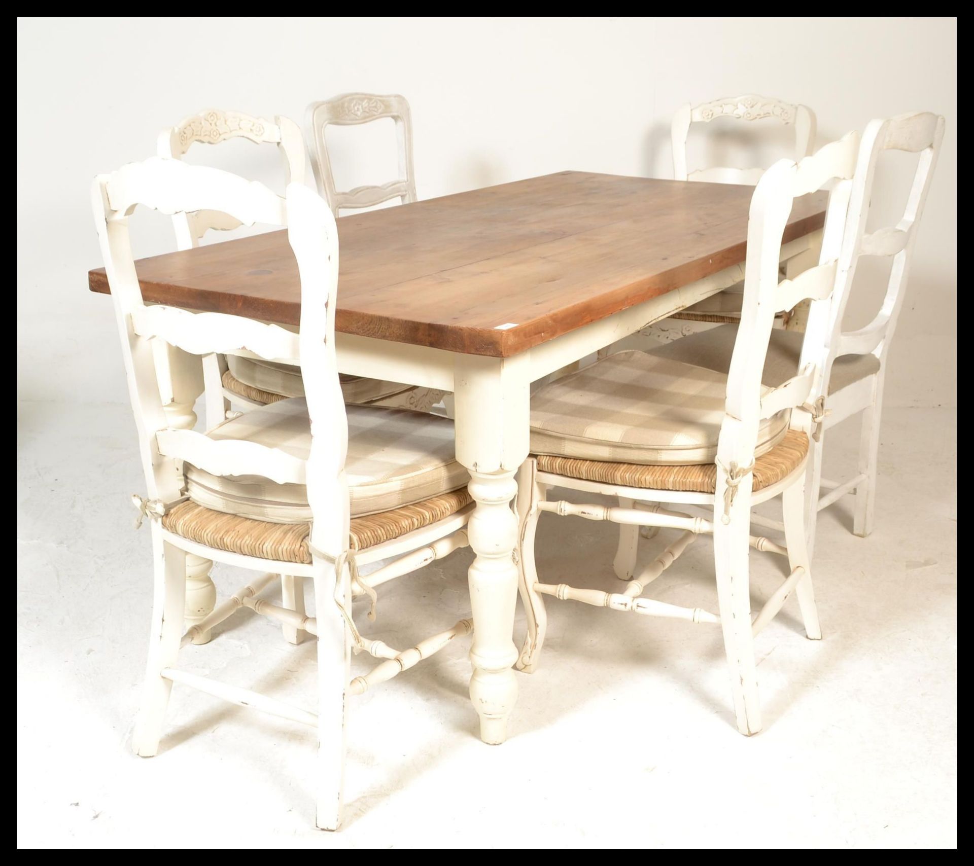 A 20th Century painted pine scrub topped farmhouse refectory dining table. Raised on painted