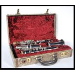 An Ebony `Student Console` Clarinet by Selmer, London, serial number 1344, in original faux