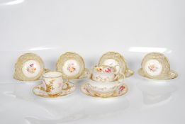 A set of four 19th/20th Century Davenport hand painted cabinet cups and saucers, together with a