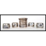 A selection of 20th Century silver white metal Persian Islamic napkin rings having niello decoration