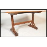 A good Victorian Arts & Crafts solid golden oak refectory dining table being raised on gothic