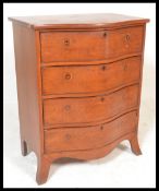 A 20th Century Georgian revival solid mahogany serpentine bachelors chest of drawers, a run of